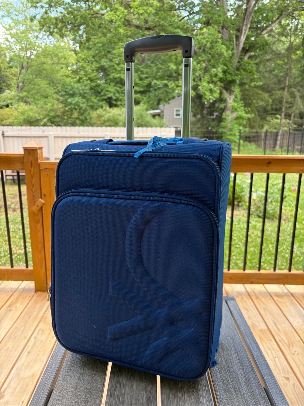 United Colors Of Benetton light Blue Softside Carry-On with Telescoping Handle